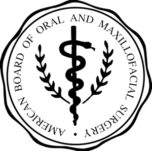 American Board of Oral & Maxillofacial Surgery Logo with a snake wrapping around a staff in between two plants.